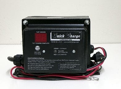 A black and red battery charger sitting on top of a table.